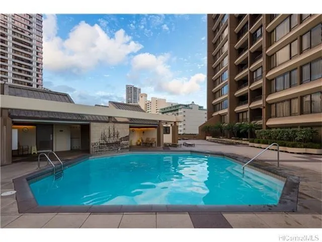 a view of a swimming pool with a patio