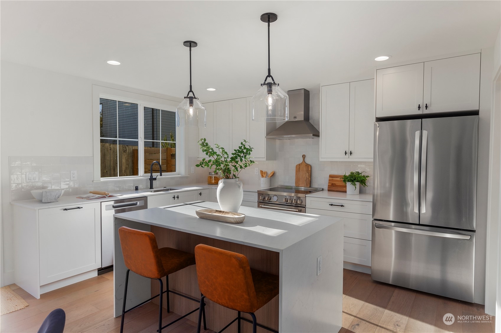3014 East Howell Street Seattle, WA 98122 - Photo 11 of 39 a kitchen with stainless steel appliances granite countertop a sink refrigerator and cabinets