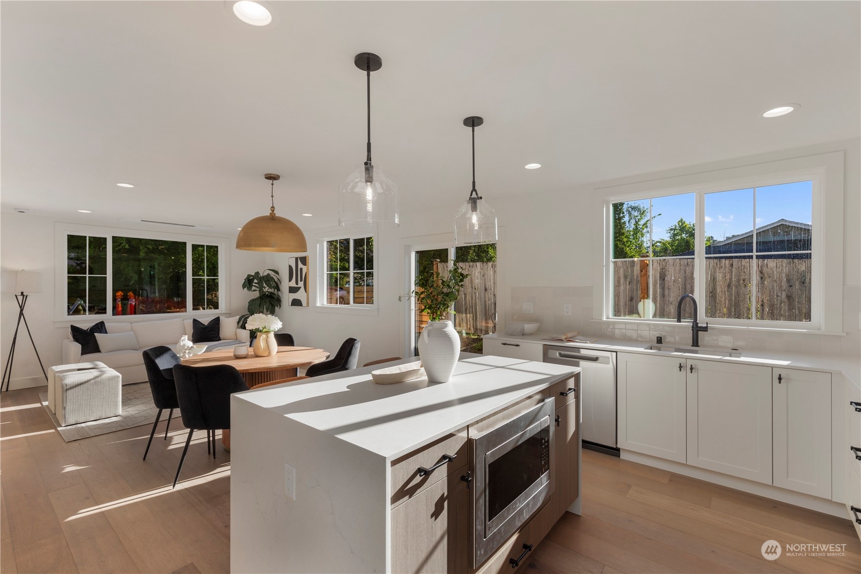 3014 East Howell Street Seattle, WA 98122 - Photo 14 of 39 a kitchen with stainless steel appliances a sink a stove and a wooden floors