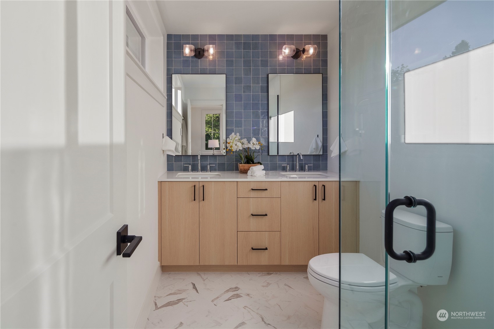 3014 East Howell Street Seattle, WA 98122 - Photo 21 of 39 a bathroom with a granite countertop sink mirror and vanity