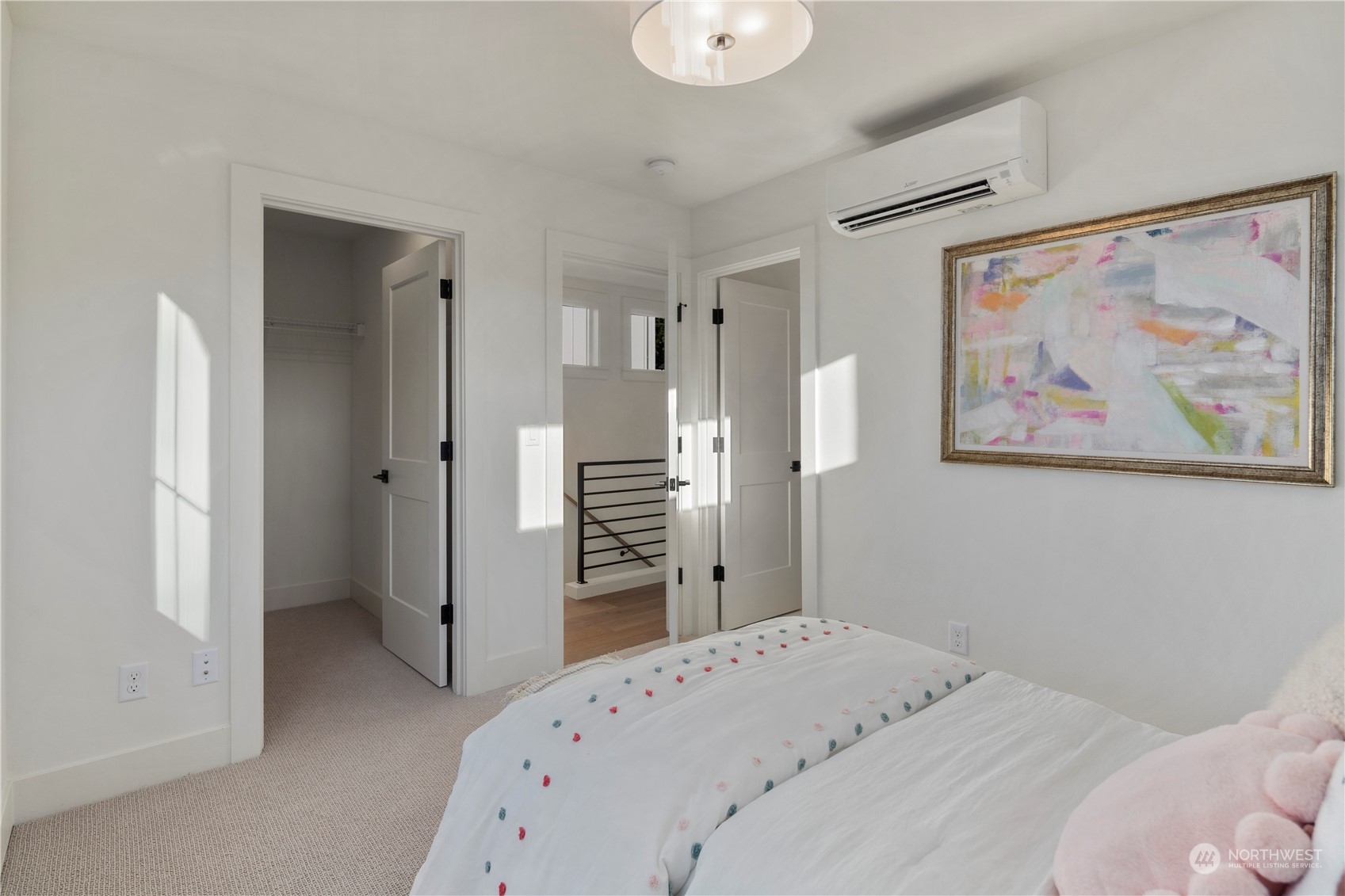 3014 East Howell Street Seattle, WA 98122 - Photo 23 of 39 a bedroom with a bed and a painting on the wall