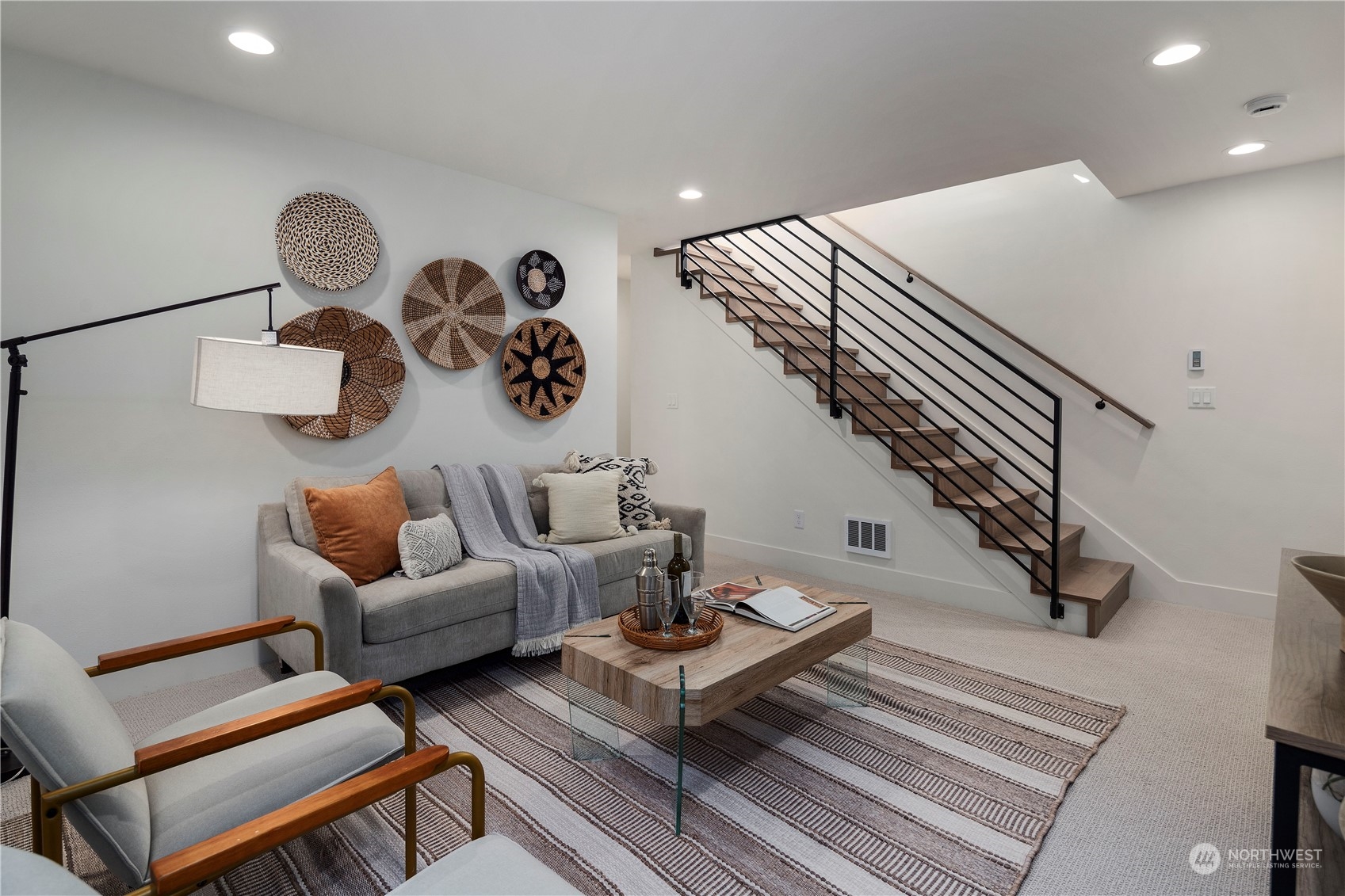 3014 East Howell Street Seattle, WA 98122 - Photo 28 of 39 a living room with couches couches and a dining table with wooden floor