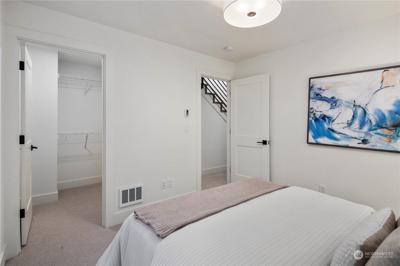 3014 East Howell Street Seattle, WA 98122 - Photo 31 of 39 a bedroom with a bed and the wall painting