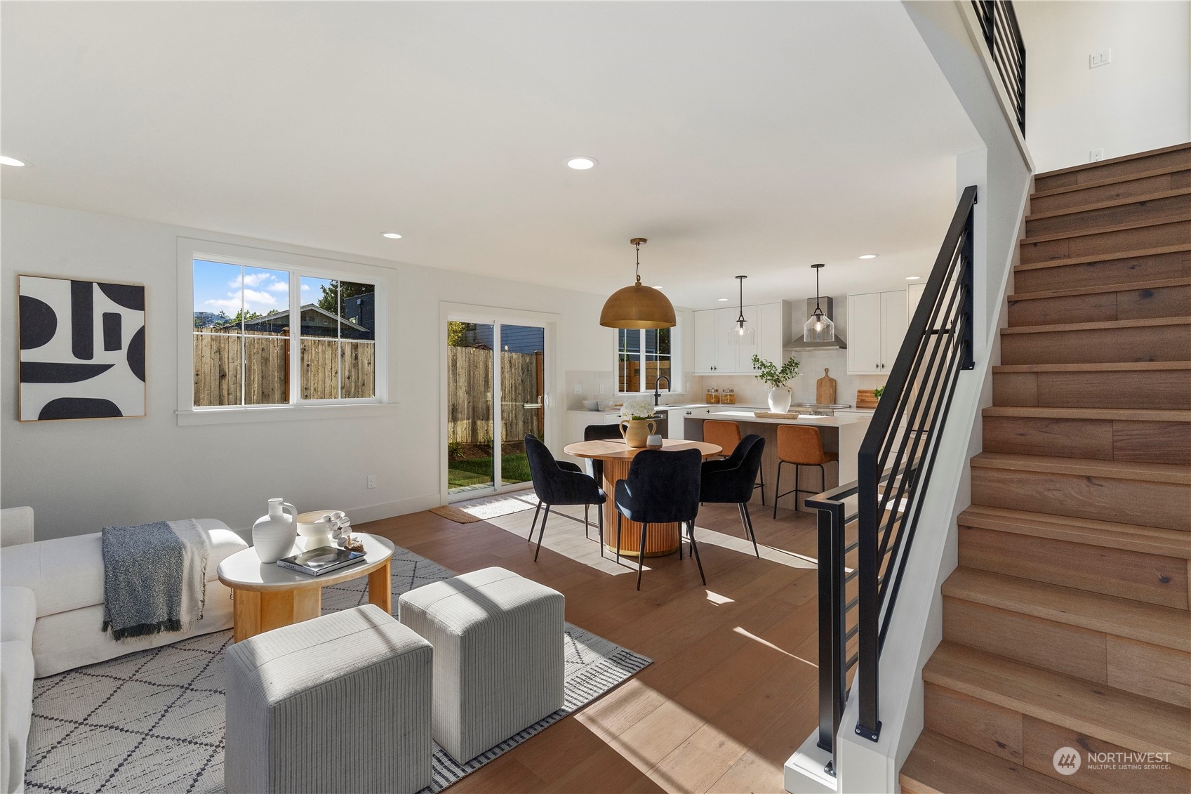 3014 East Howell Street Seattle, WA 98122 - Photo 4 of 39 a living room with furniture a dining table and a piano with wooden floor