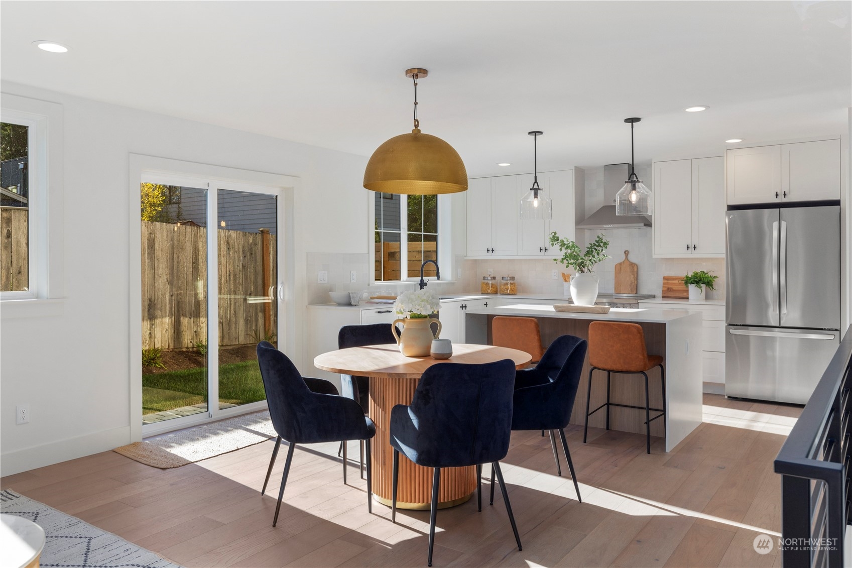 3014 East Howell Street Seattle, WA 98122 - Photo 5 of 39 a dining room with furniture a chandelier and wooden floor