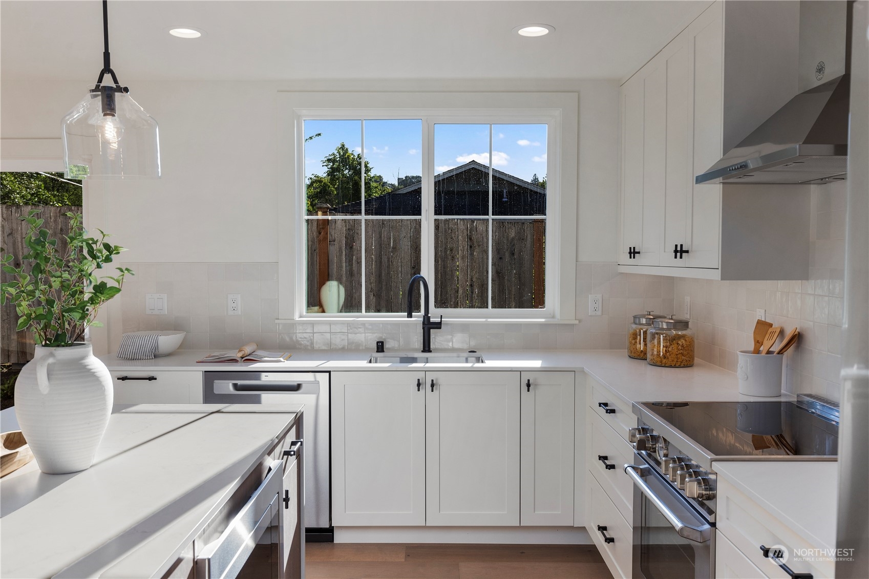 3014 East Howell Street Seattle, WA 98122 - Photo 10 of 39 a kitchen with a sink and cabinets