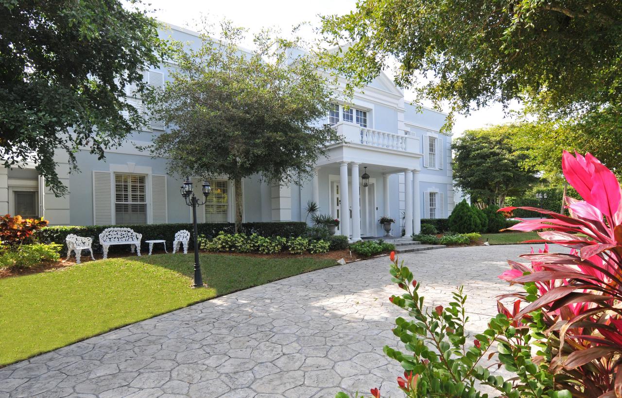 202 Indian Road Palm Beach, FL 33480 - Photo 1 of 24 a front view of a house with a yard and porch