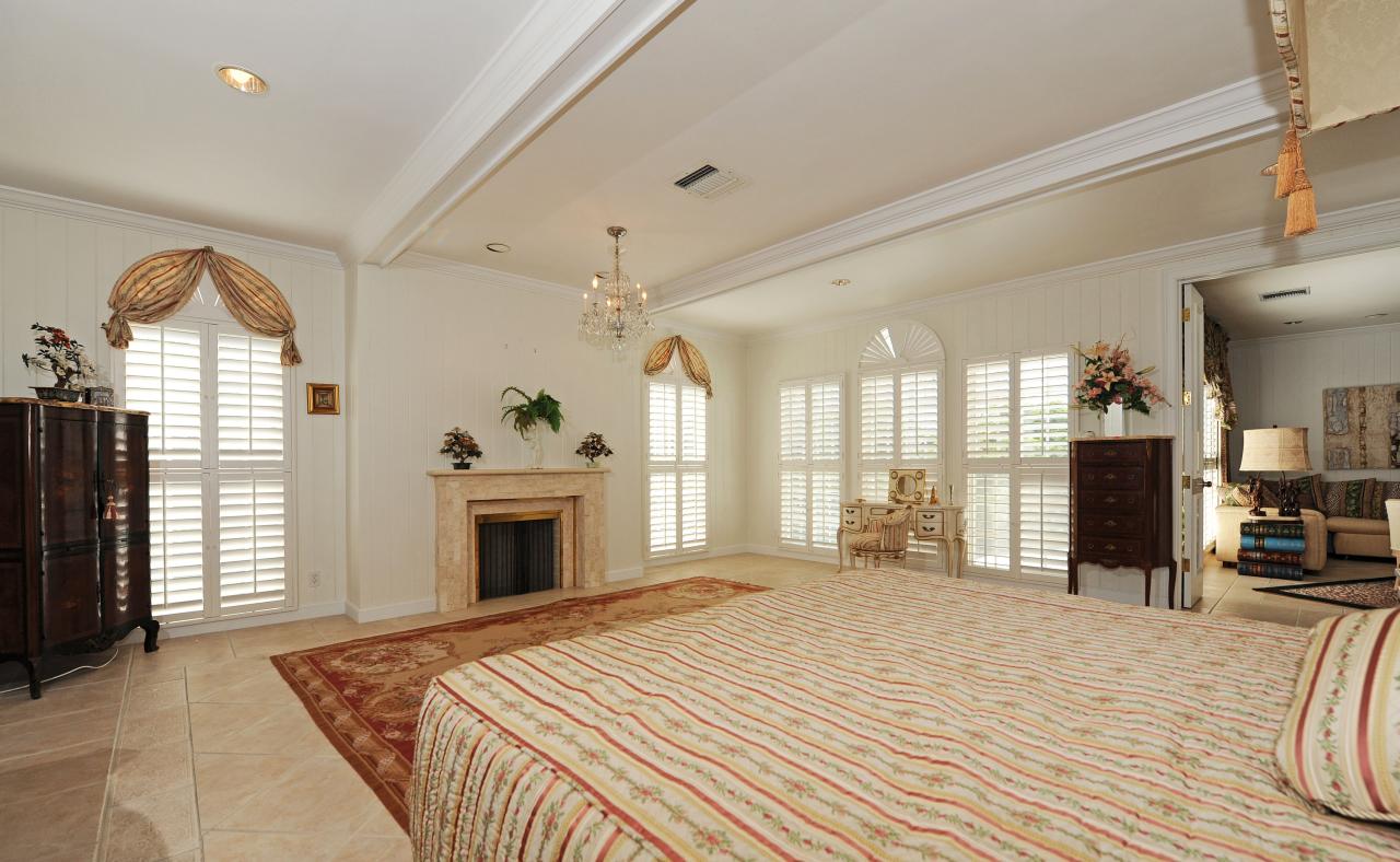 202 Indian Road Palm Beach, FL 33480 - Photo 15 of 24 a view of a livingroom with a fireplace window and wooden floor