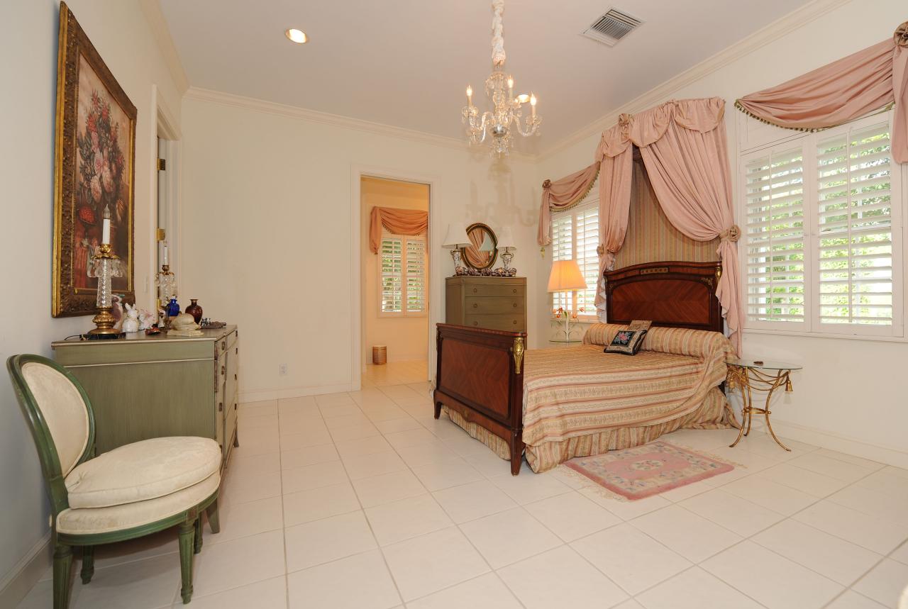 202 Indian Road Palm Beach, FL 33480 - Photo 19 of 24 a living room with furniture a fireplace and a chandelier
