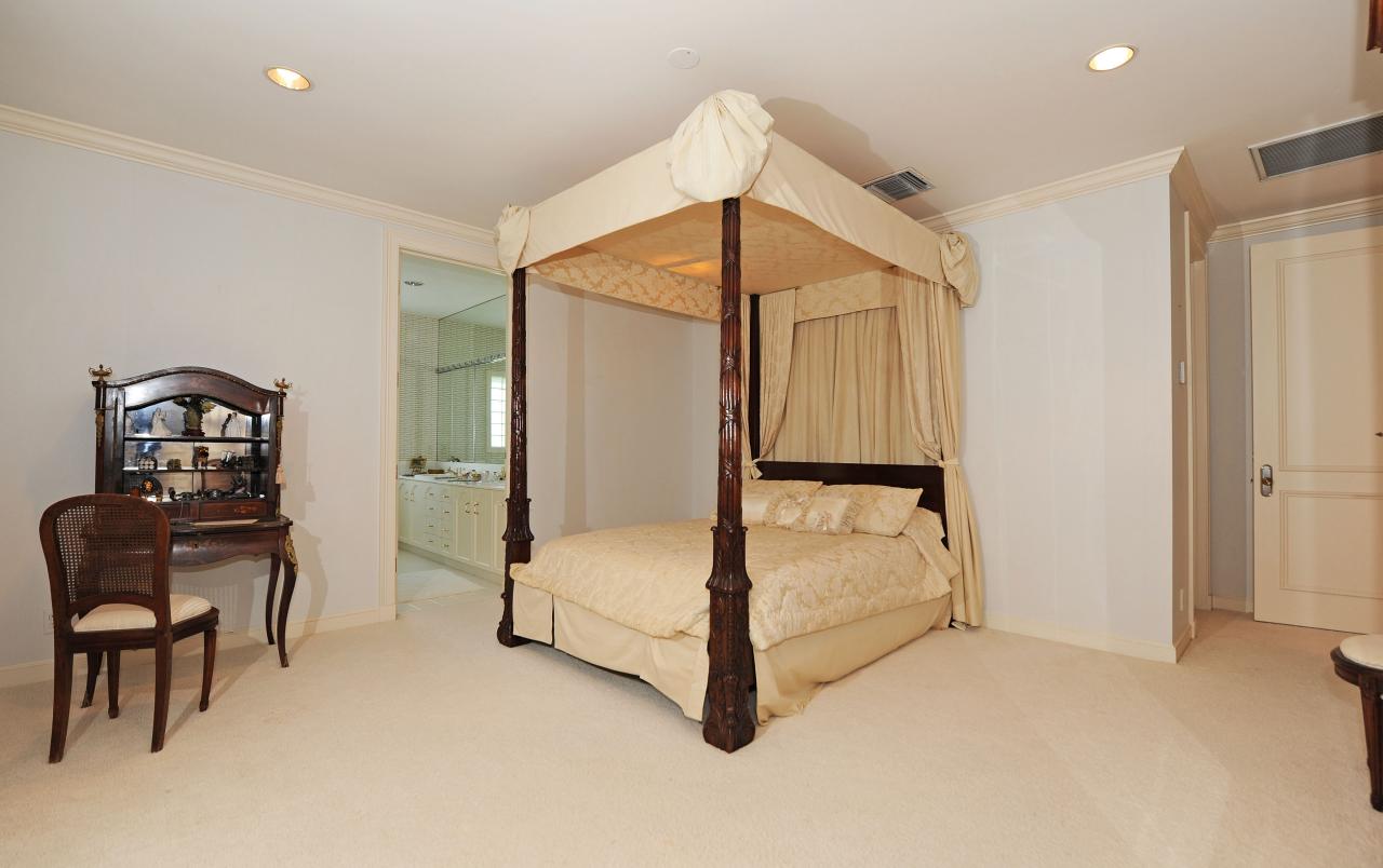 202 Indian Road Palm Beach, FL 33480 - Photo 21 of 24 a bedroom with a bed and a chair