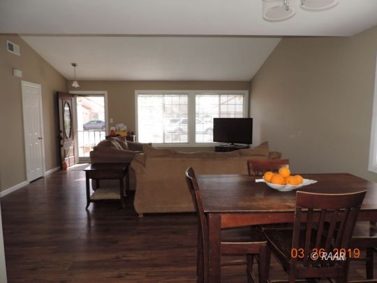 627 North Rio Bravo Street Ridgecrest, CA 93555 - Photo 2 of 6 a workspace with furniture and wooden floor