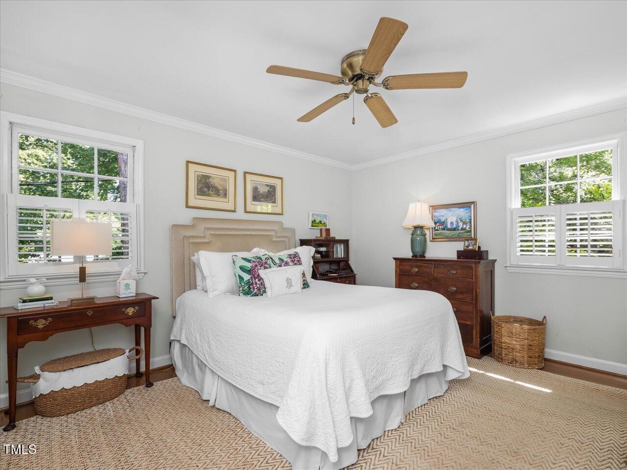 4112 Rowan Street Raleigh, NC 27609 - Photo 15 of 35 a bedroom with a large bed and a window