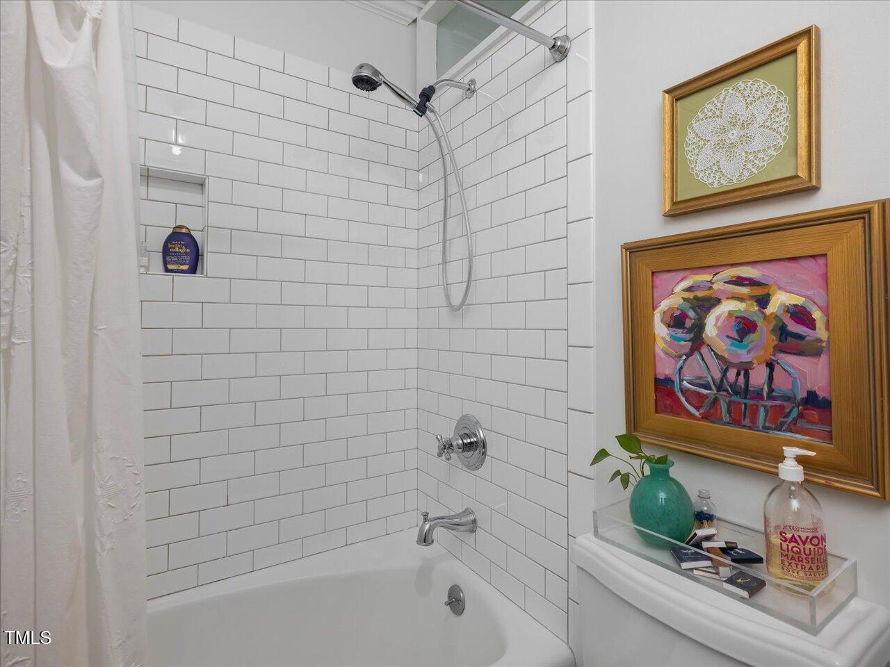 4112 Rowan Street Raleigh, NC 27609 - Photo 18 of 35 a bathroom with a toilet and a shower