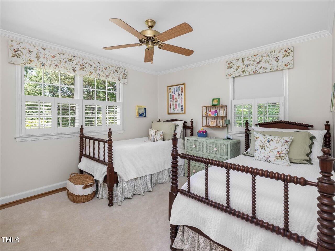 4112 Rowan Street Raleigh, NC 27609 - Photo 19 of 35 a bedroom with furniture and a large window