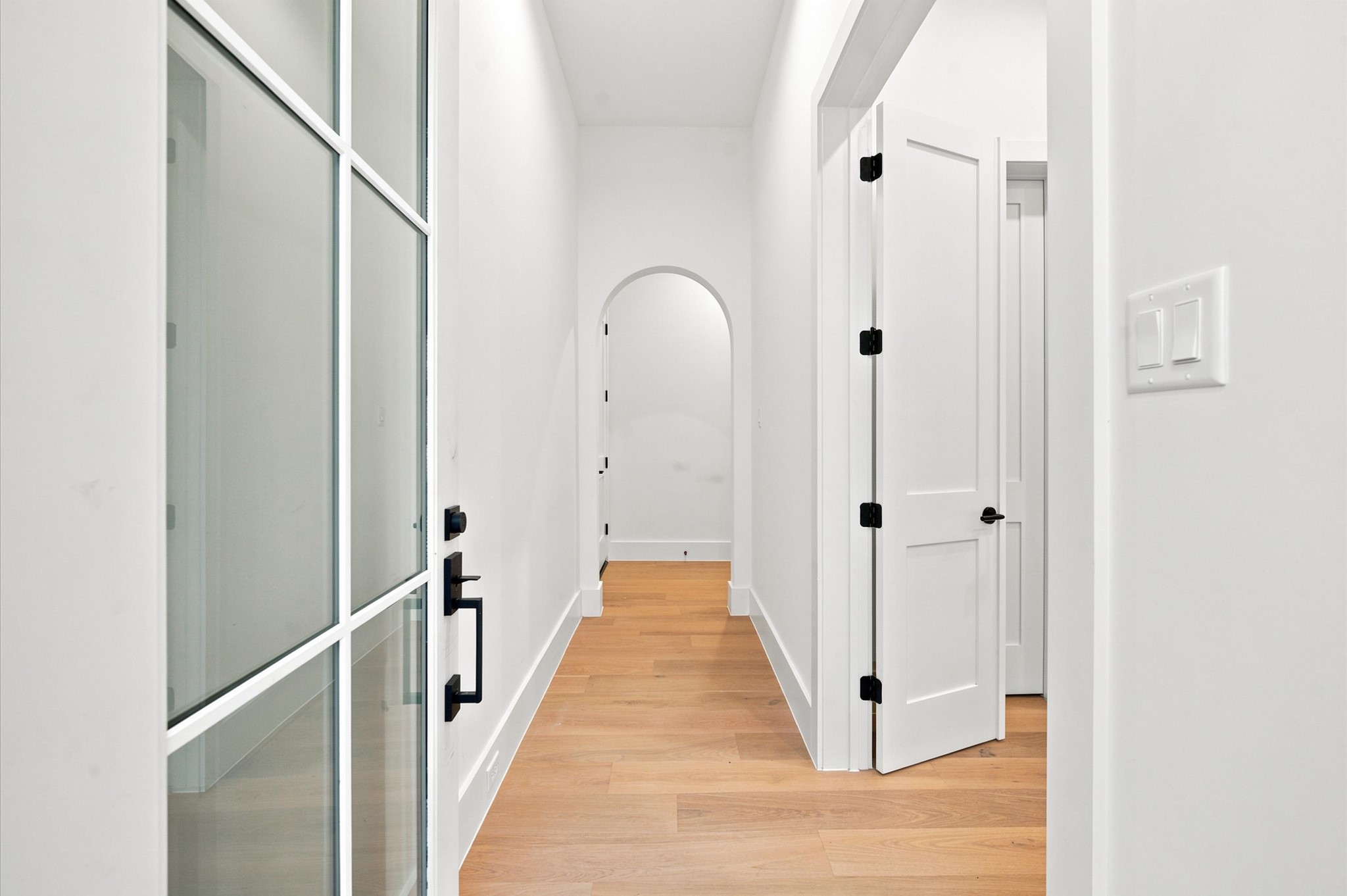 112 East 27th Street Houston, TX 77008 - Photo 5 of 43 Step inside this thoughtfully designed home featuring elegant arched doorways throughout.