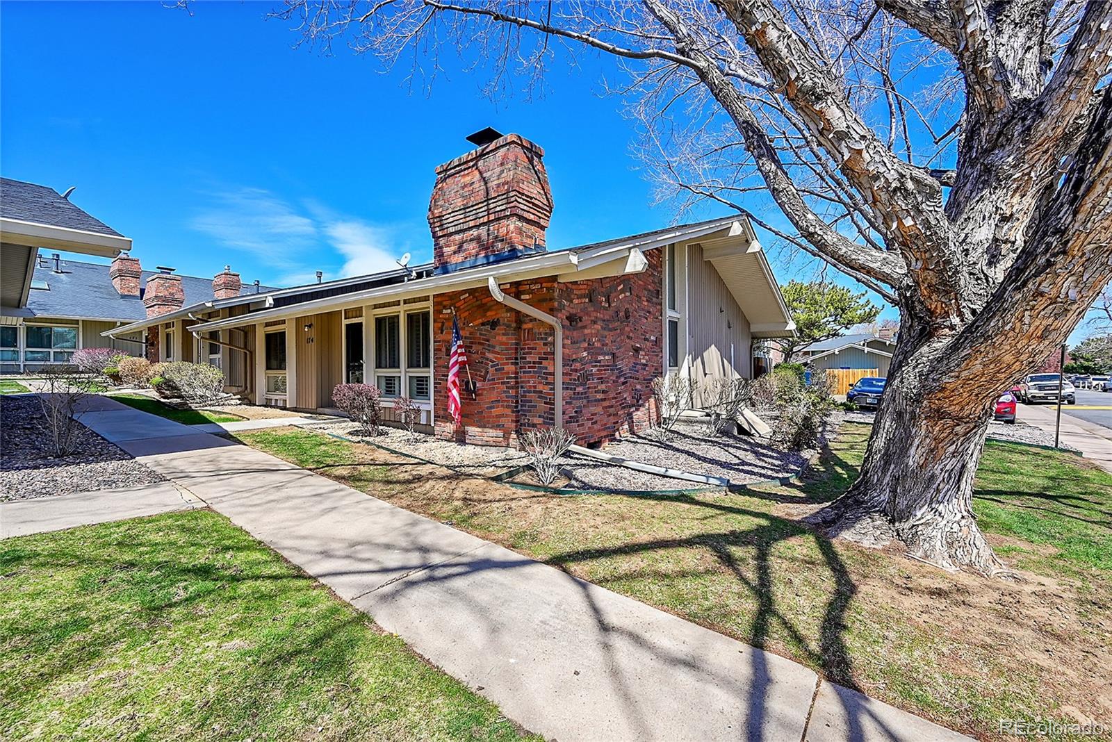 6495 East Happy Canyon Road, Unit 174 Denver, CO 80237 - Photo 1 of 32 a front view of a house with garden