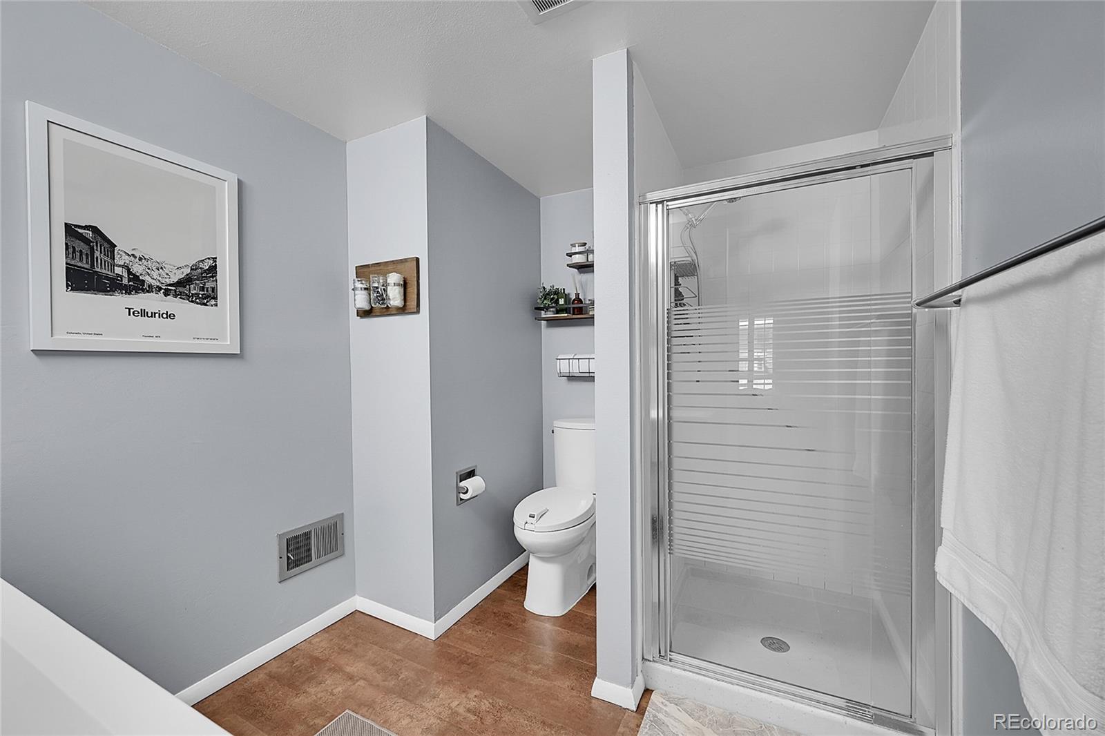 6495 East Happy Canyon Road, Unit 174 Denver, CO 80237 - Photo 16 of 32 a bathroom with a shower and toilet