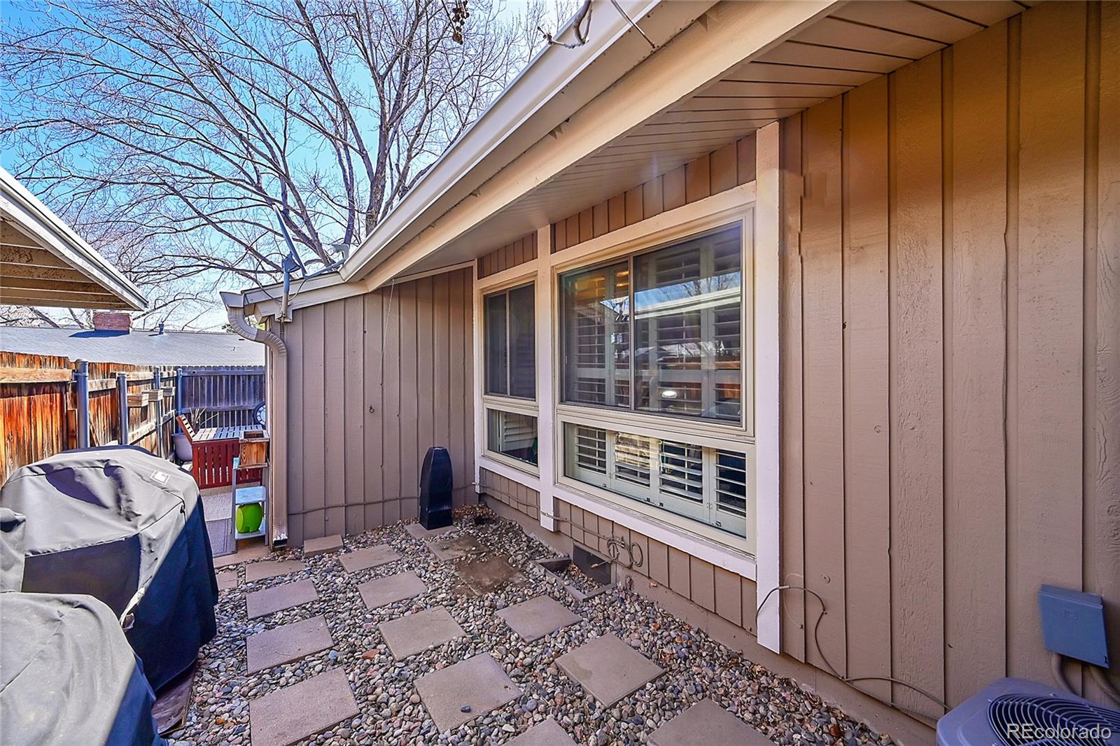 6495 East Happy Canyon Road, Unit 174 Denver, CO 80237 - Photo 23 of 32 a front view of a house with a yard
