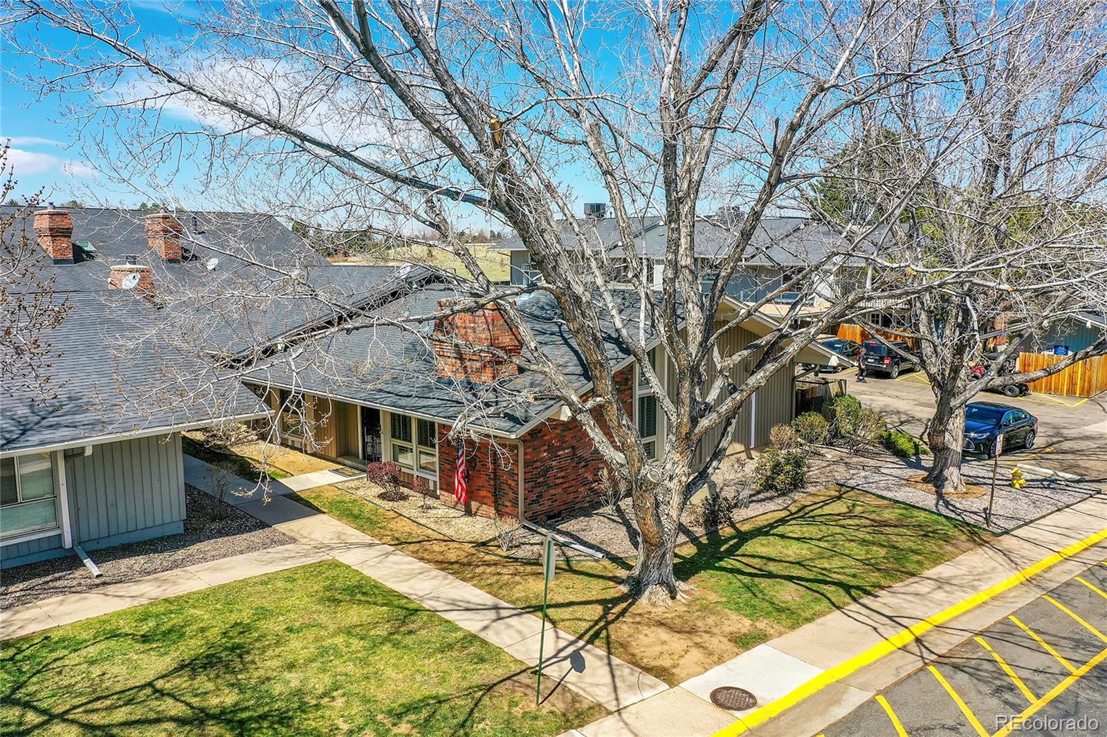 6495 East Happy Canyon Road, Unit 174 Denver, CO 80237 - Photo 25 of 32 a view of a house with a yard