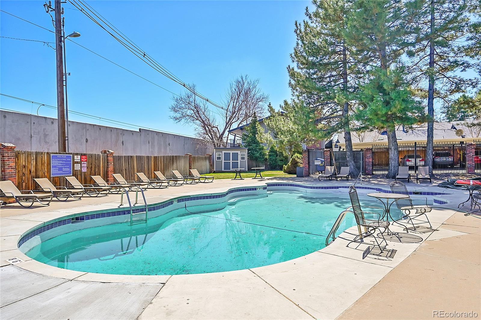 6495 East Happy Canyon Road, Unit 174 Denver, CO 80237 - Photo 29 of 32 a view of a swimming pool with a patio