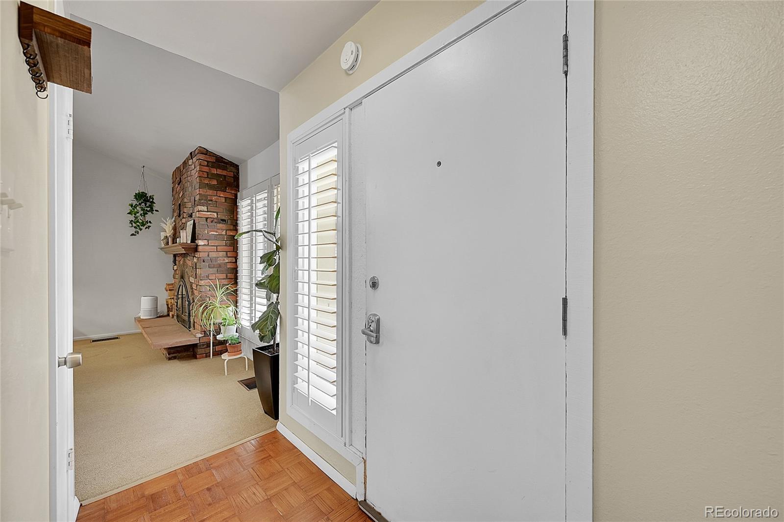 6495 East Happy Canyon Road, Unit 174 Denver, CO 80237 - Photo 3 of 32 a view of a bedroom with hallway