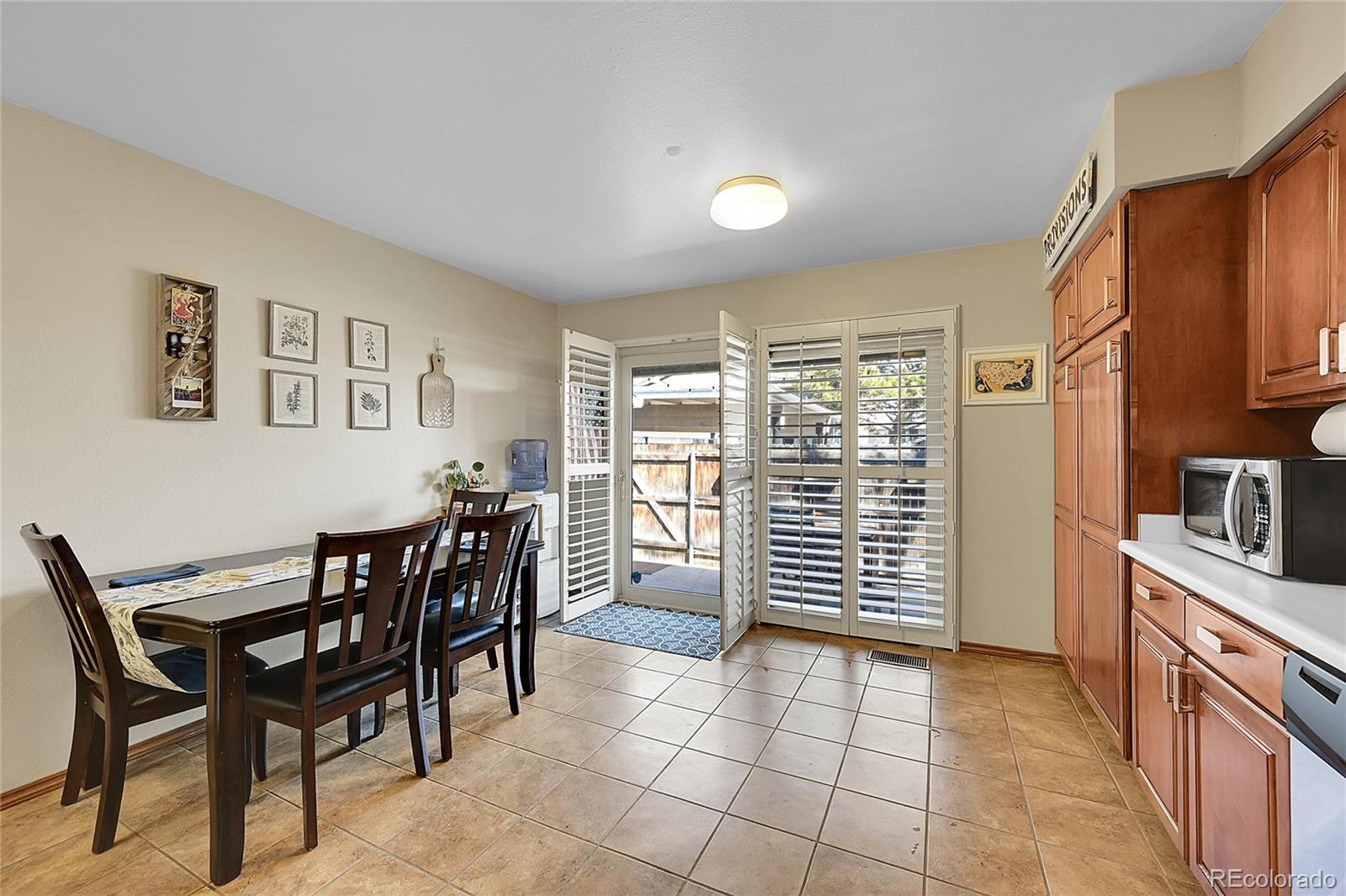 6495 East Happy Canyon Road, Unit 174 Denver, CO 80237 - Photo 10 of 32 a view of a dining room with furniture