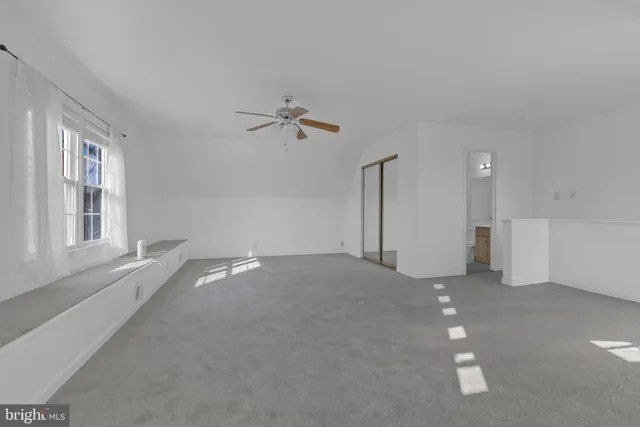 a view of empty room with windows