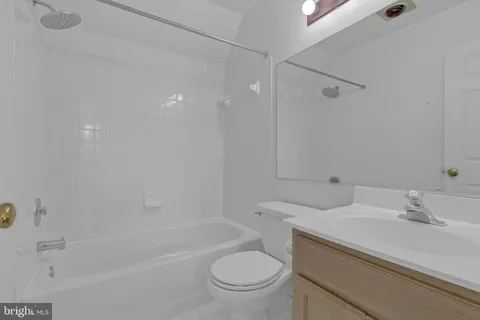 a bathroom with a sink a toilet and a bathtub
