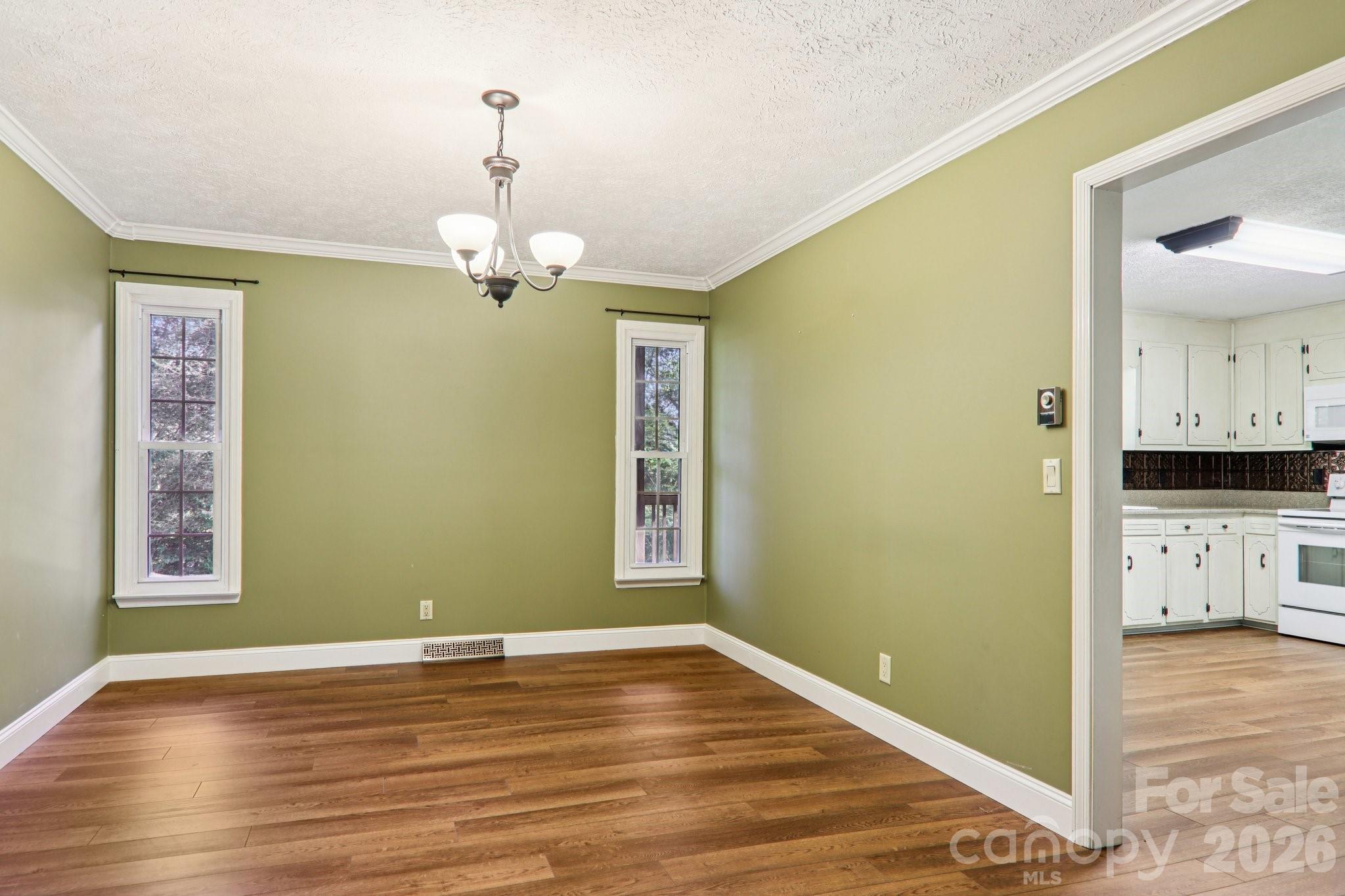 261 Eastview Road Brevard, NC 28712 - Photo 12 of 15 a view of a bedroom with wooden floor