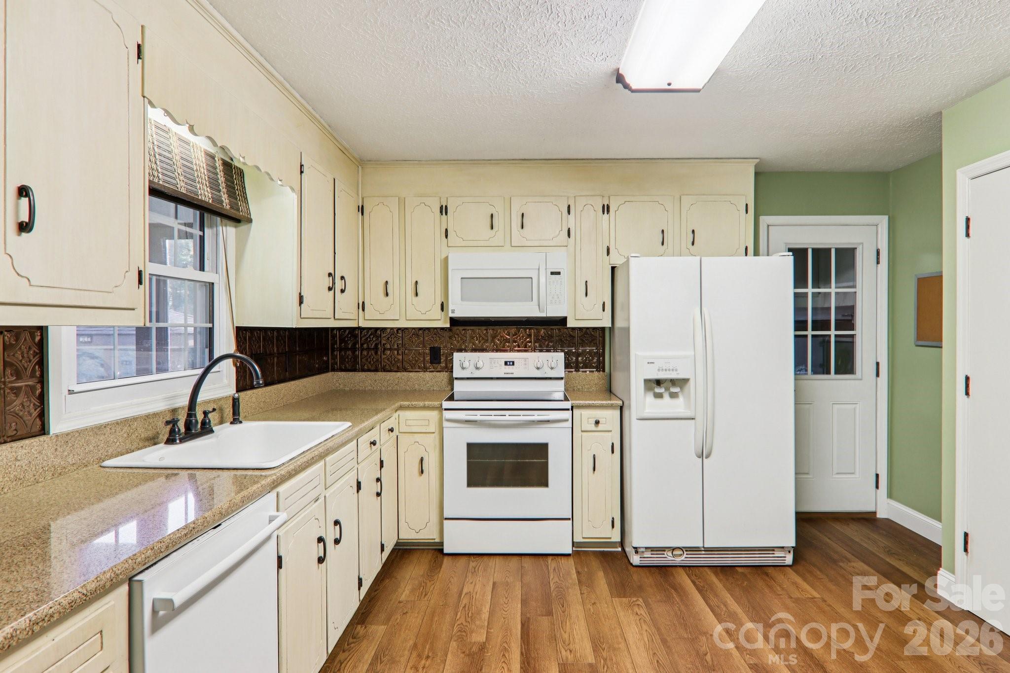261 Eastview Road Brevard, NC 28712 - Photo 14 of 15 a kitchen with a refrigerator sink and stove