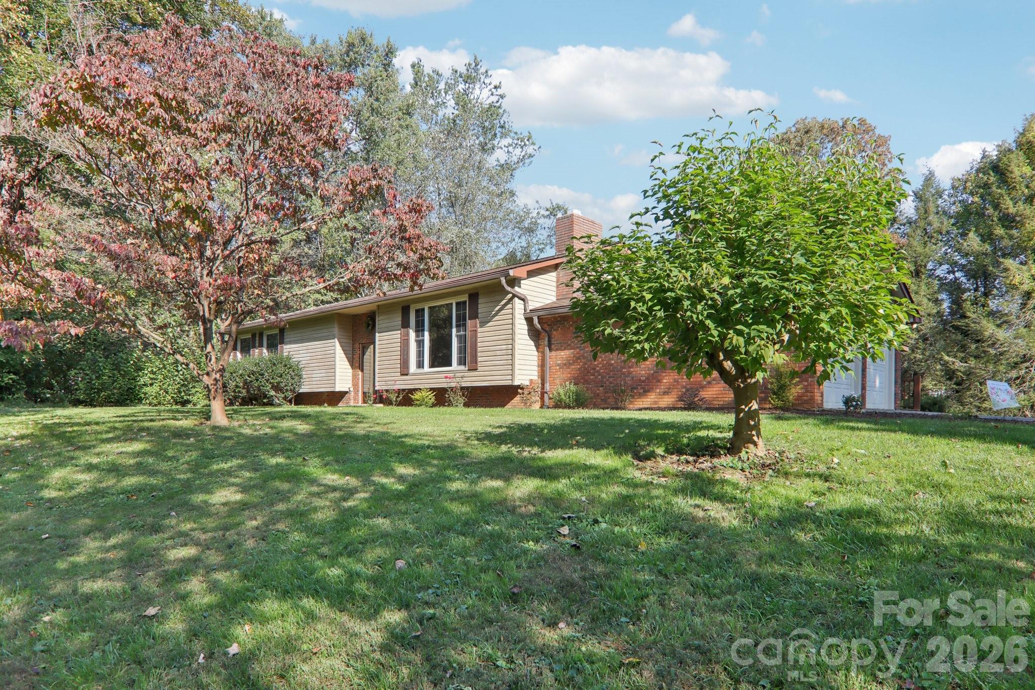 261 Eastview Road Brevard, NC 28712 - Photo 2 of 15 a view of a house with a backyard