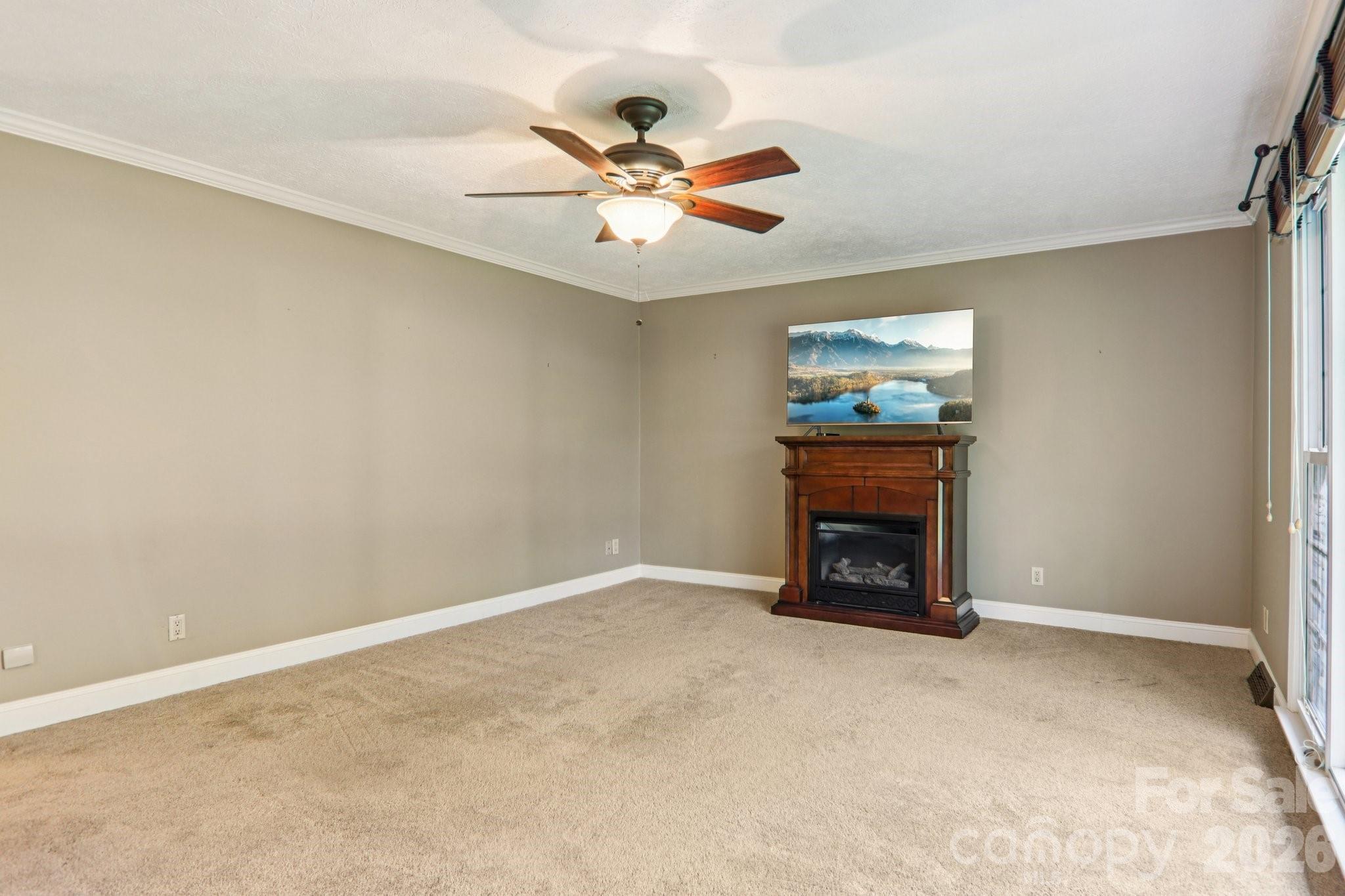 261 Eastview Road Brevard, NC 28712 - Photo 7 of 15 a view of an empty room with a fireplace