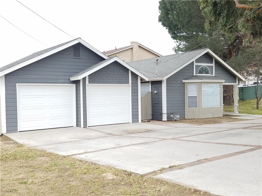 a front view of a house with a garage