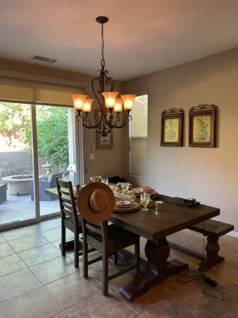 a view of a dining room with furniture window and outside view