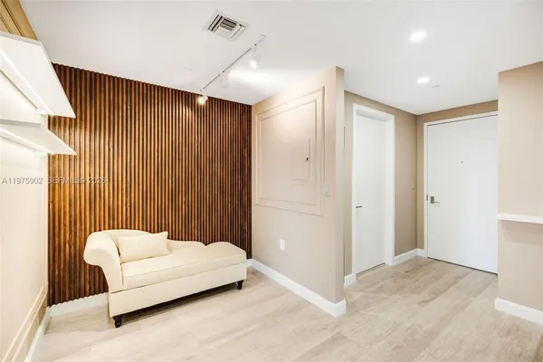 a spacious bedroom with a bed and a couch