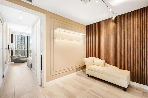 a bedroom with a bed and a couch