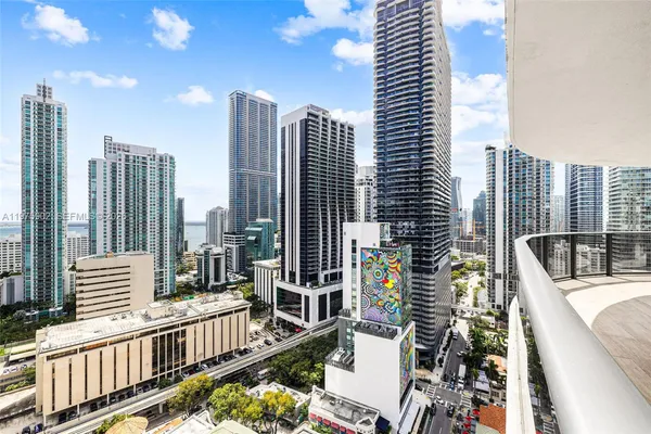 a view of buildings from the balcony