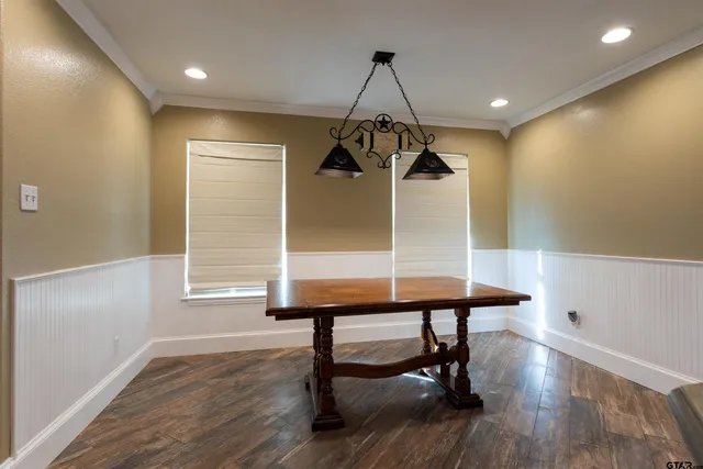 a room with table and chairs