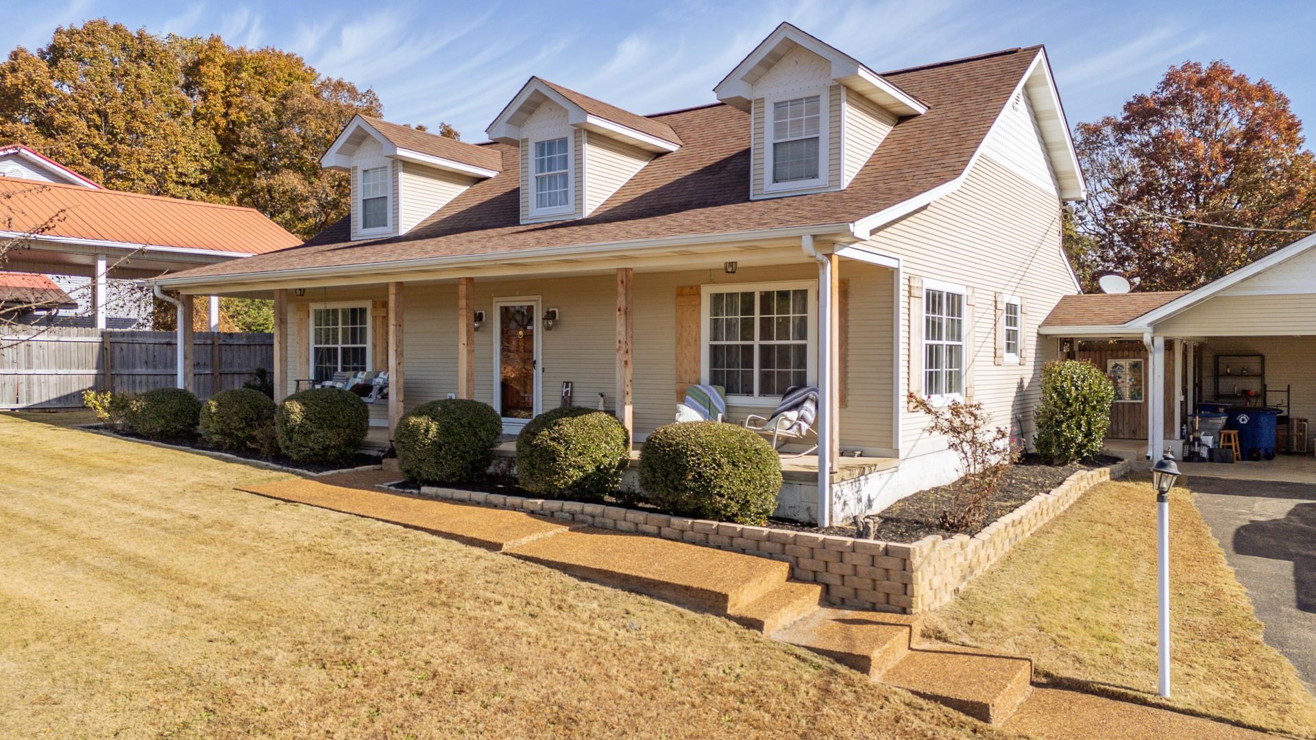 345 Dancer Road Selmer, TN 38375 - Photo 2 of 24 View of front of home with covered porch and roof with shingles