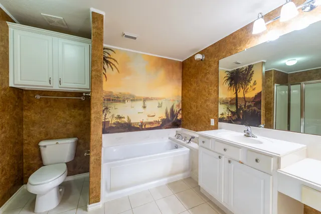 a bathroom with a sink a toilet and a bathtub