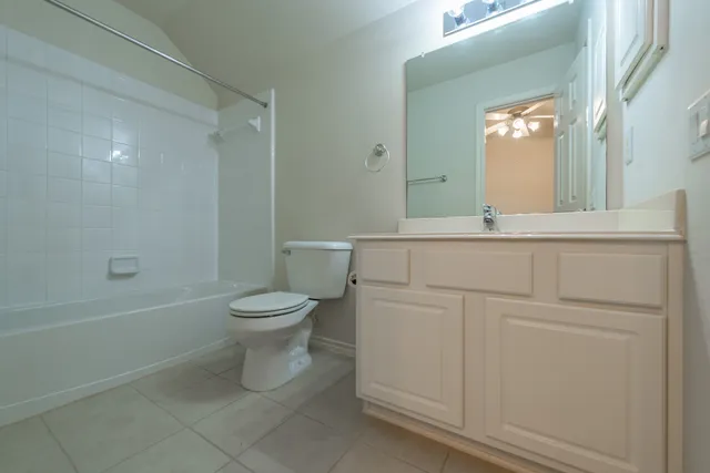 a bathroom with a toilet a sink and a bathtub