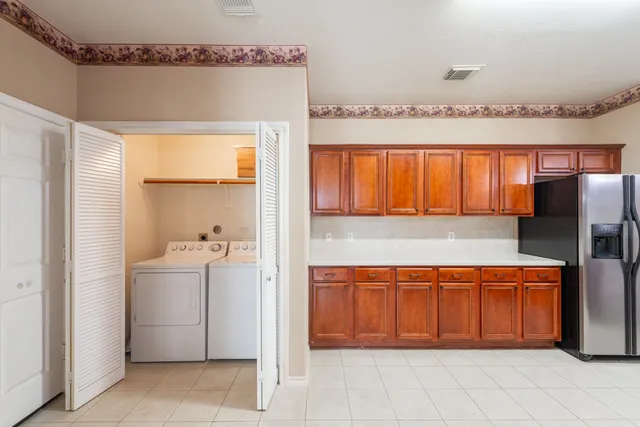 a view of a kitchen with a fridge