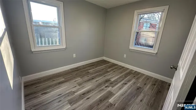 a bathroom with a bathtub shower sink vanity and toilet