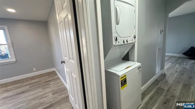 a kitchen with stainless steel appliances a refrigerator sink and cabinets