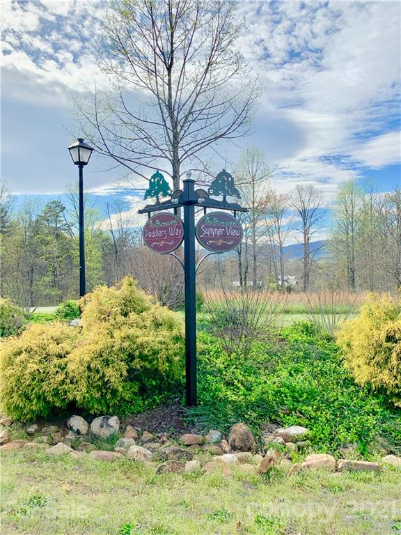 0 Peddlers Way Rutherfordton, NC 28139 - Photo 11 of 21 a view of a garden with a bench