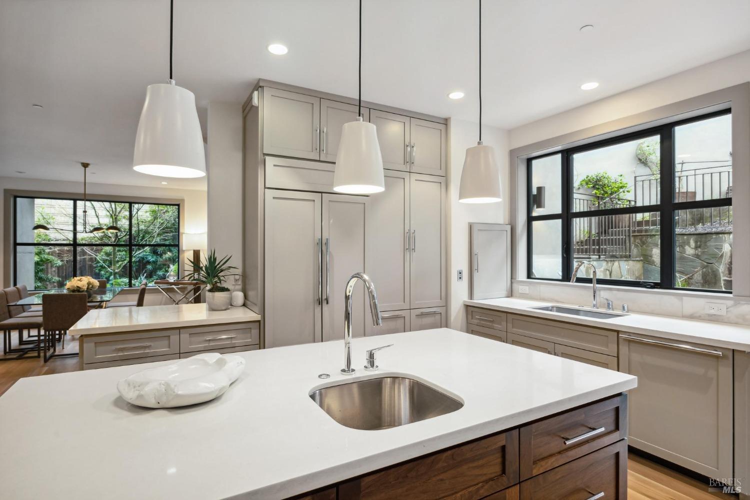 23 Janes Street Mill Valley, CA 94941 - Photo 11 of 32 a kitchen with a sink a large window and stainless steel appliances