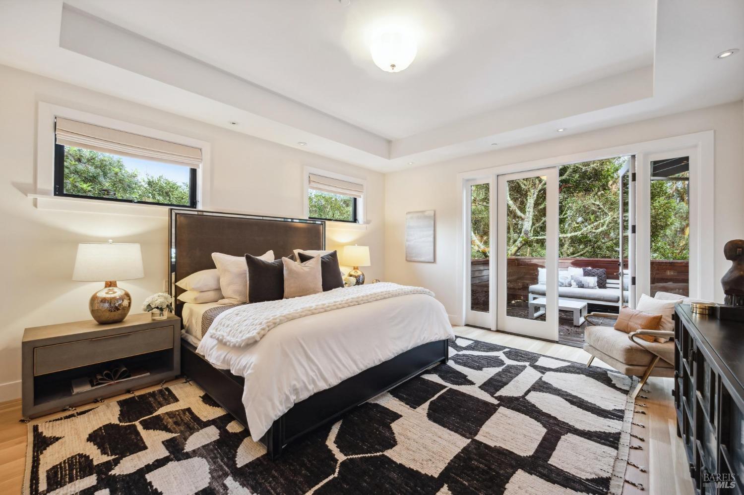 23 Janes Street Mill Valley, CA 94941 - Photo 23 of 32 a bedroom with a bed and wooden floor