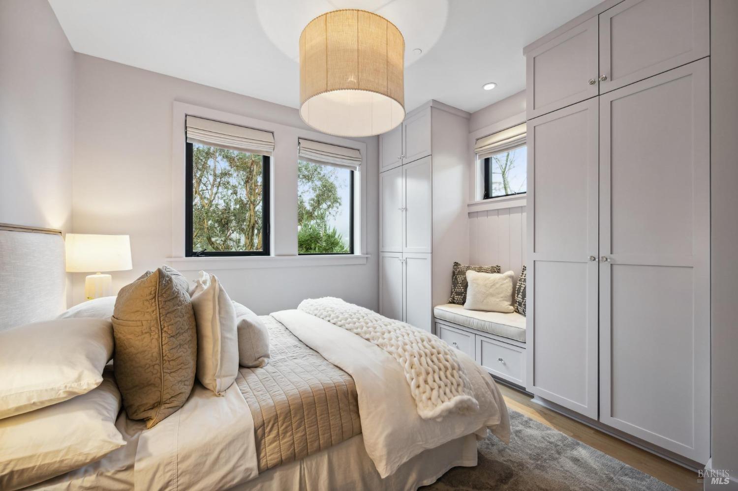 23 Janes Street Mill Valley, CA 94941 - Photo 27 of 32 a bedroom with a bed and a painting on the wall