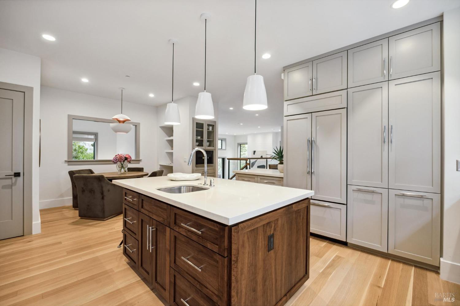 23 Janes Street Mill Valley, CA 94941 - Photo 8 of 32 a kitchen with kitchen island a sink stove and wooden floor