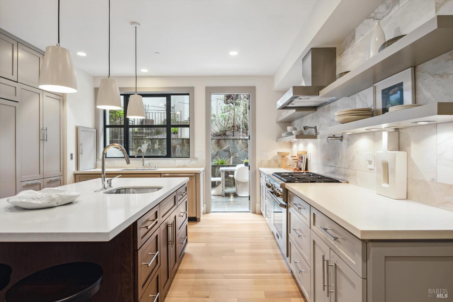 23 Janes Street Mill Valley, CA 94941 - Photo 10 of 32 a kitchen with stainless steel appliances granite countertop a sink and a stove